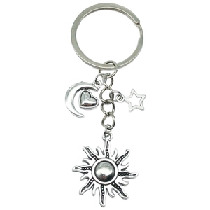 Celestial silver alloy keychain featuring moon heart star pendants on a simple keyring
