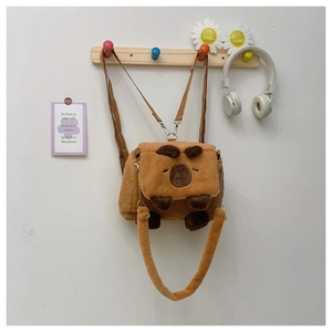 Detail of cute Capybara plush crossbody bag featuring metal hooks and soft brown fur