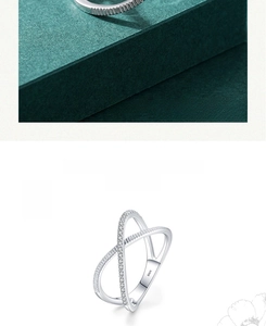 Macro view of S925 sterling silver ring showing X-shape cross and micro-pave zircons