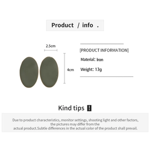 Detail view of dark green oval earrings with 4cm height, iron material and 13g weight
