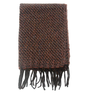 Detailed view of autumn winter scarf with zigzag knit pattern and black fringe tassels