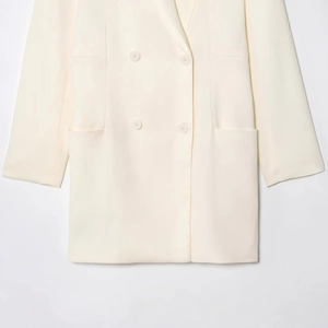 Elegant cream double-breasted blazer for women with textured fabric and wide lapels