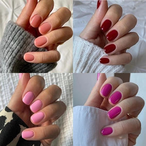 Short press-on nails set featuring solid peach, deep red, light pink and magenta colors
