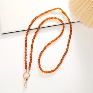 Detail view of 120cm amber crystal beaded phone crossbody strap with gold metal lobster clasp