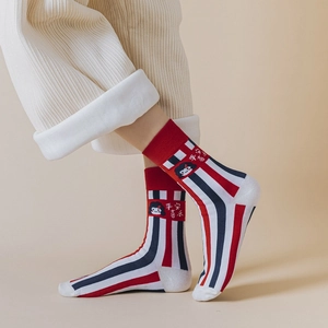 Festive red and white striped cotton socks with Chinese character embroidery on model