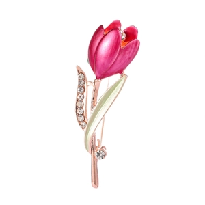 Detailed macro view of tulip brooch with pink enamel petals and sparkling rhinestones