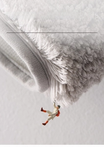 Macro detail of the high-density grey fiber pile on non-shedding bathroom rug