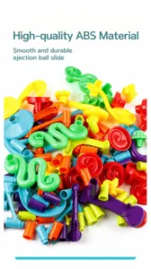 Detailed close-up of colorful ABS plastic building blocks and track parts for ball maze