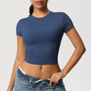 Close-up of tight navy blue short sleeve crop top in breathable stretch fabric