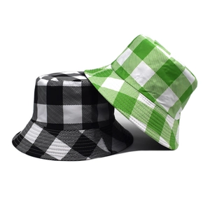 Double-sided reversible plaid bucket hat in black-white and green-white canvas
