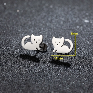 Macro shot of asymmetrical cat stud earrings in silver steel with size markings