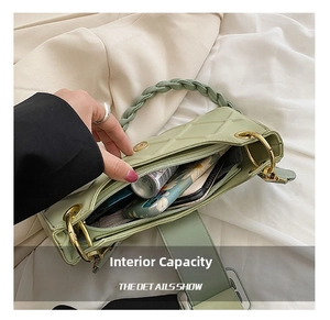 Detail view of sage green quilted handbag interior showing spacious daily storage