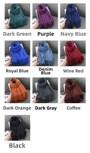 Detailed palette of thick cashmere-feel scarves featuring fringe in ten classic winter tones