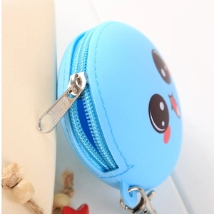 Close-up of blue silicone coin purse featuring cartoon face and metal swivel hook