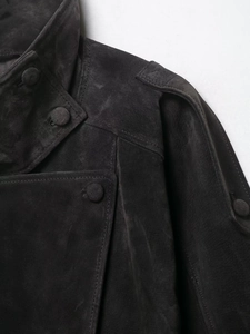 Detail of suede biker jacket featuring lapel collar, matching buttons and epaulettes