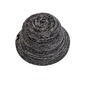 Top view of breathable knit bucket hat showing detailed black and white speckled texture