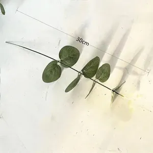 Detail view of 30cm artificial eucalyptus leaf branch with clear textures and green seeds