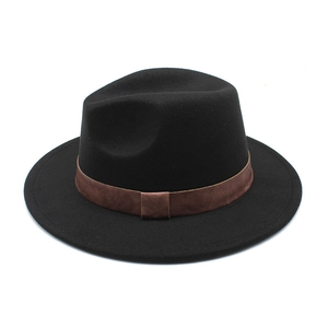 Detail of classic black wool fedora featuring a wide flat brim and brown leather band