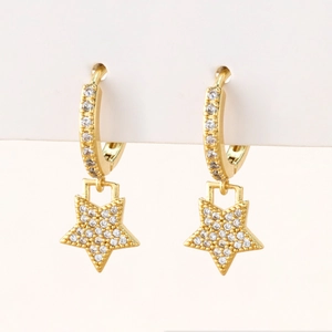 Close-up of gold star drop earrings with micro-pave white cubic zirconia on white card