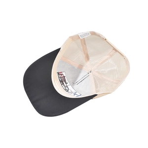 Detailed macro view of the 80% cotton trucker hat inner lining and fabric care label