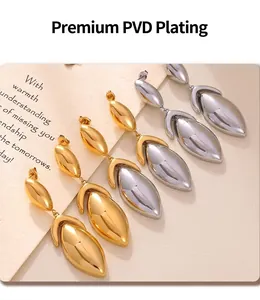 Detailed macro view of geometric leaf pendants with premium gold and silver PVD plating
