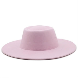 Detailed close-up of smooth pink wool felt surface on flat top fedora hat crown