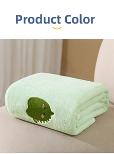 Detail of light green coral fleece baby towel with cute dark green dinosaur embroidery