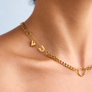 18K gold plated stainless steel paperclip necklace with heart pendant on a female model