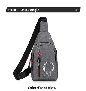 Front view of grey oxford crossbody bag with red zipper pulls and music graphic detail