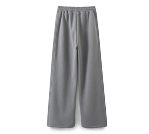 Detail of high-waisted dark grey wide-leg sweatpants with comfortable elastic waistband