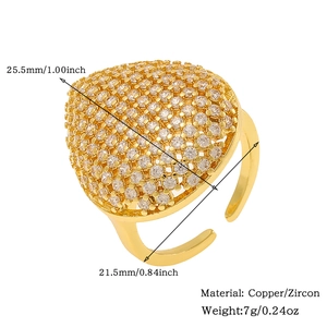 Detail view of heart-shaped gold ring with white zircon paving and size measurements