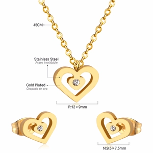 Macro view of gold-plated heart jewelry set with chain length and pendant size details