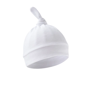 Detail of white cotton newborn knotted hat with adjustable top knot and soft folded brim