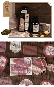 Detail of vintage floral stickers and gold-stamped labels in retro box for journaling