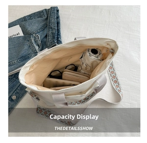 Detail of white canvas tote bag interior showing ample capacity for daily essentials