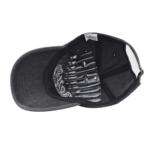 Detail view of cotton baseball cap interior showing 100% cotton label and stitching