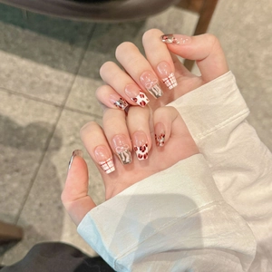 Handmade press-on nails featuring French pink leopard print, grid bow, and heart designs