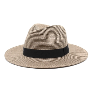 Close-up of natural straw fedora weaving texture and black decorative ribbon band