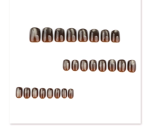 Flat lay set of 24 short square cat eye press-on nails in amber brown and grey gradient