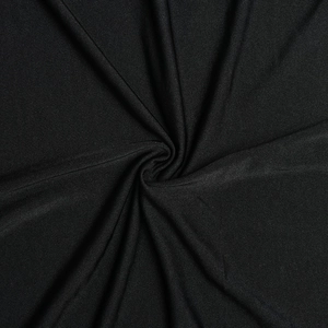 Macro detail of black elastic fabric texture with subtle sheen and elegant drapery