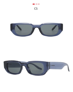 Detail view of translucent dark blue rectangular sunglasses with wide temples