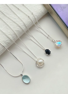 S925 silver necklace collection featuring blue gemstone, pearl, and black stone pendants