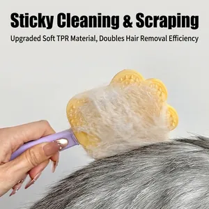 Handheld yellow paw-shaped pet hair remover brush with TPR soft rubber on cat fur