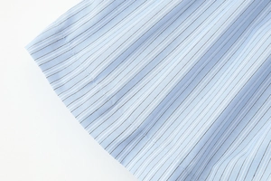 Close-up of blue and white vertical striped fabric texture on a cotton blend shirt