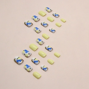 Short square lemon yellow press-on nails with blue floral pattern designs, 24 piece set