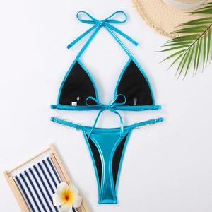 Close-up of metallic teal bikini with side rings and adjustable tie-up straps