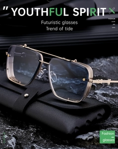 Detail of square gold metal steampunk sunglasses with side mesh shields and blue lenses