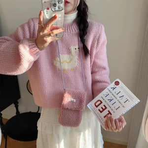 Pink plush mini crossbody bag paired with matching knit sweater and cute duck pattern