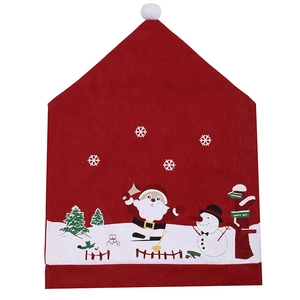 Detail of Christmas chair cover with Santa and snowman patterns on a red felt fabric