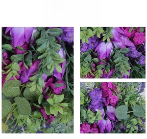 Macro shot of artificial purple tulips and mixed green foliage for spring wreath decor